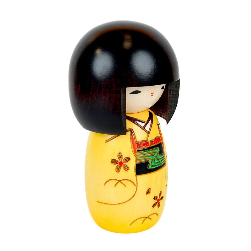Keltainen Kokeshi-nukke