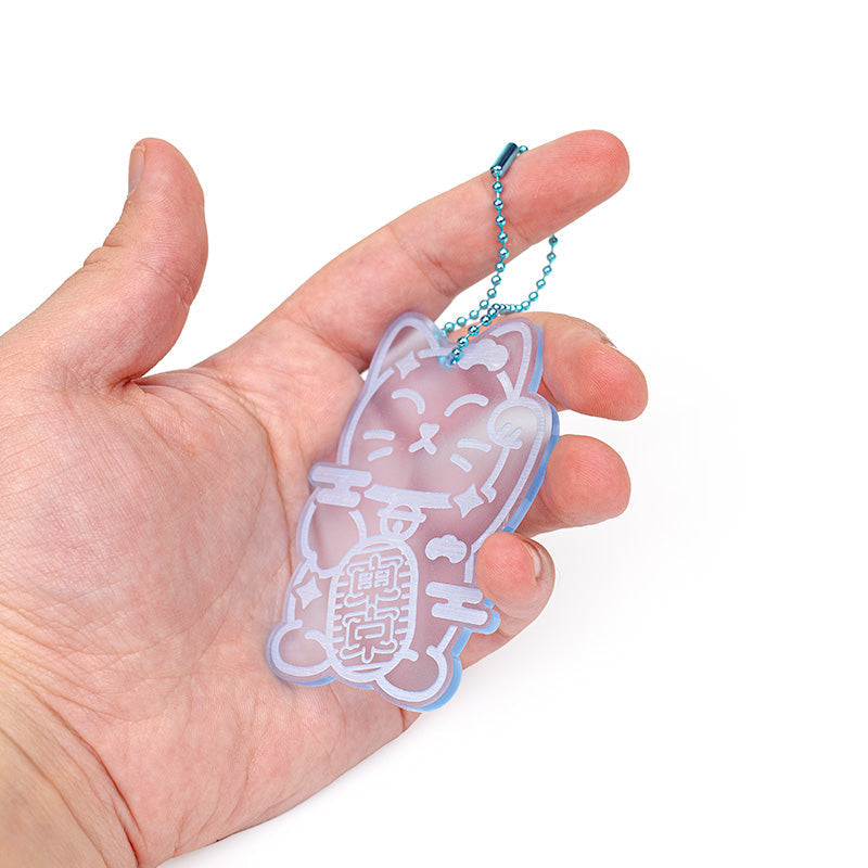 Maneki Neko -avaimenperä, fluoresoiva sininen