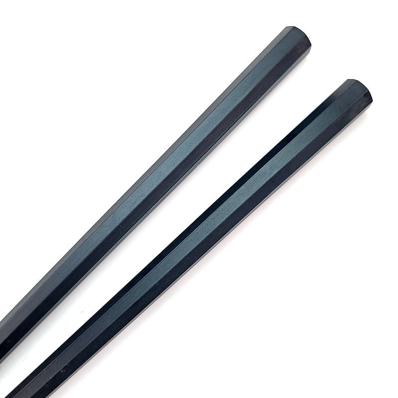 5 parin mustien syömäpuikkojen sarja