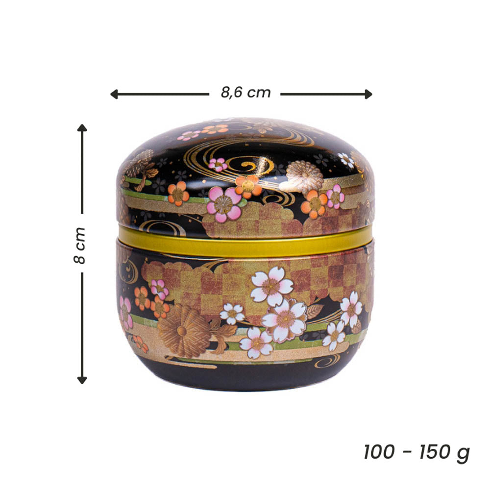 Pyöreä, musta, kukkakuvioinen japanilainen metallinen teepurkki