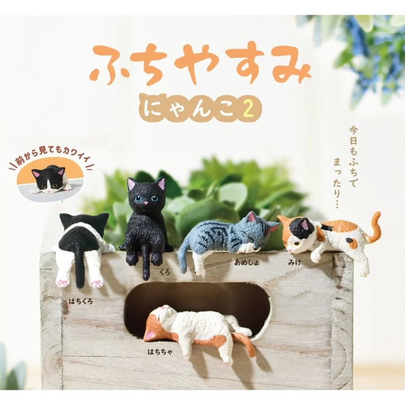 Gachapon nukkuva kissa figuuri