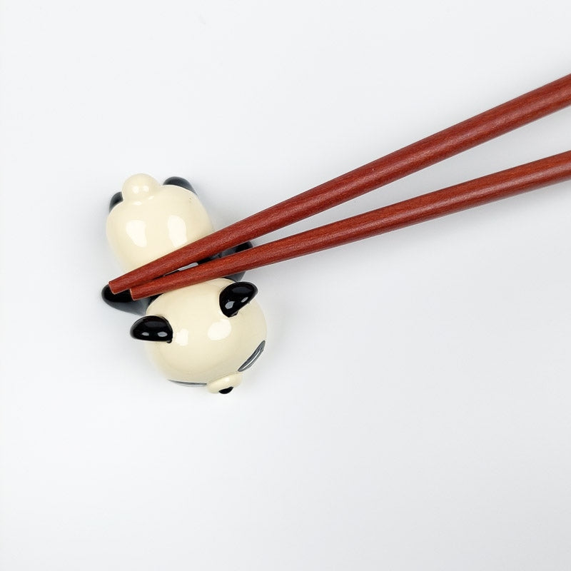 Japanilainen Panda syömäpuikko lepää