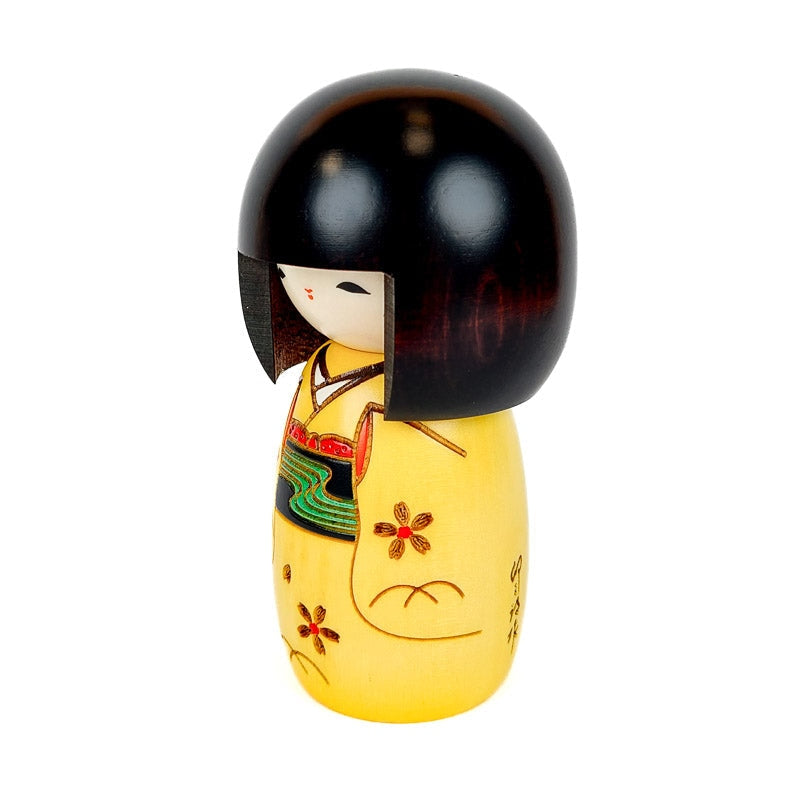 Keltainen Kokeshi-nukke