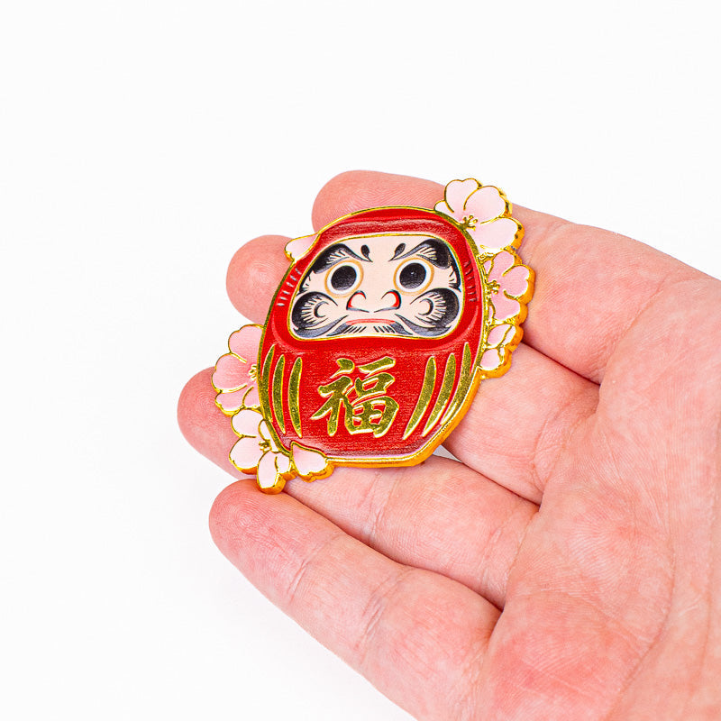 Japanilainen metallinen Daruma- ja Sakura-magneetti