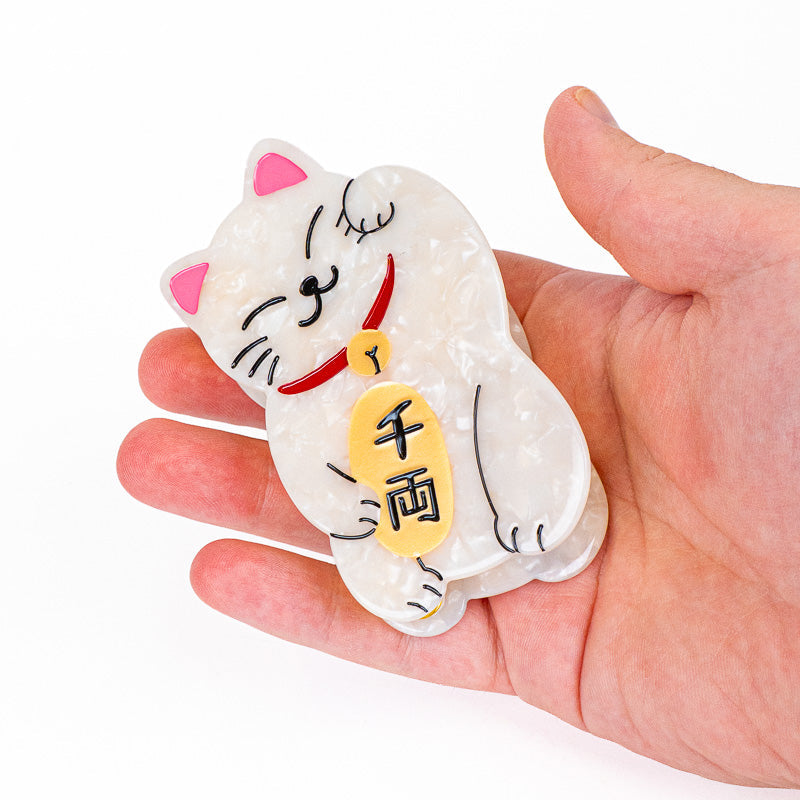 Japanilainen Maneki-Neko-hiussalpa