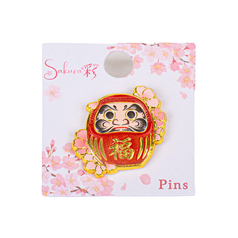 Japanilaiset metalliset rintaneulat: Daruma ja Sakura